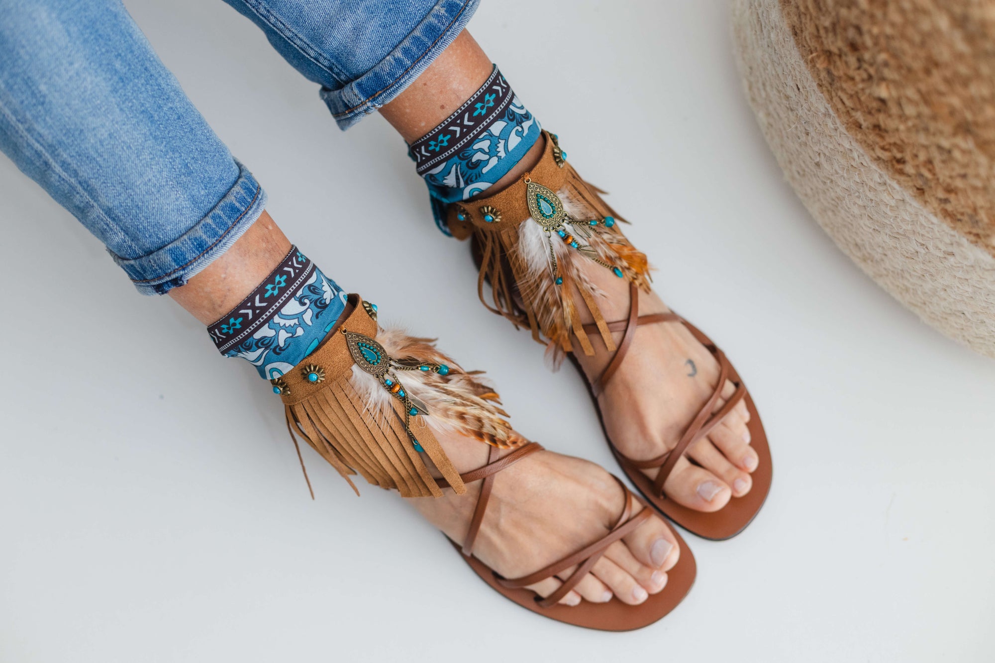 Fringed camel ankle cuffs with turquoise dreamcatcher